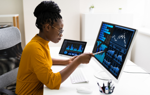 A woman working on data management on her computer