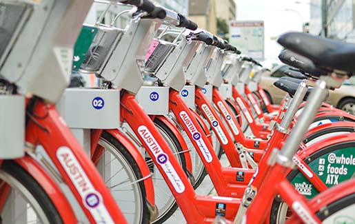 A row of rental bikes in downtown Austin