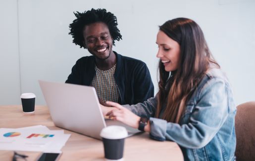 Two students studying technology with coffee