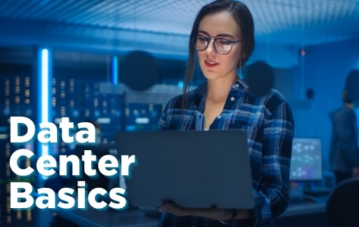 Data Center Basics Woman in data center working on laptop