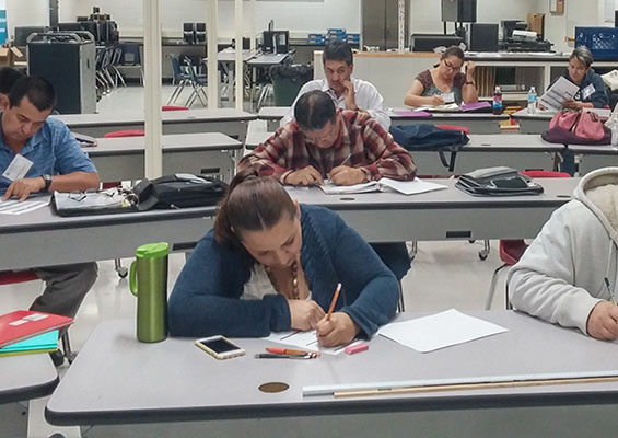 Students work on a written assignment during class