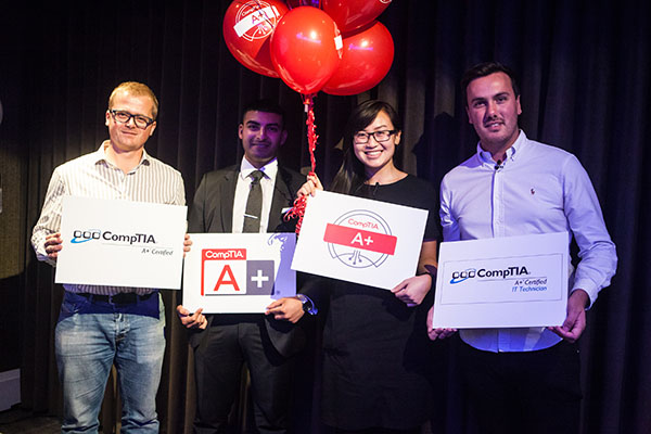 The four panelists pose with their CompTIA A+ logos