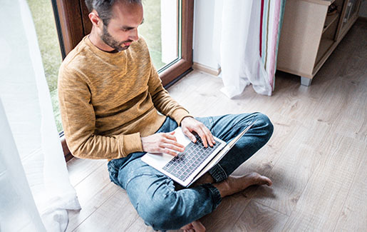 Free Threat Intelligence Feeds A cybersecurity pro accesses threat intelligence feeds on his laptop