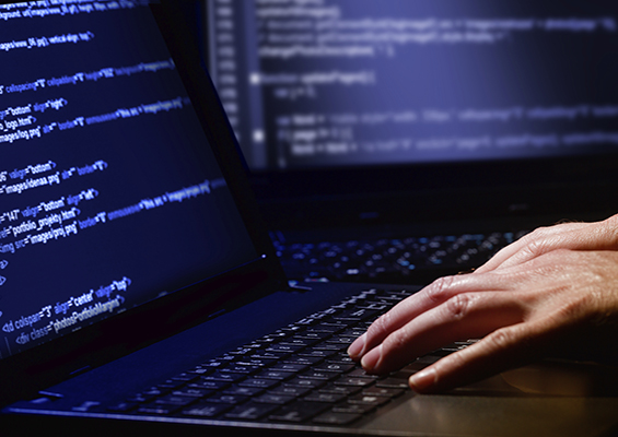 A hacker typing code