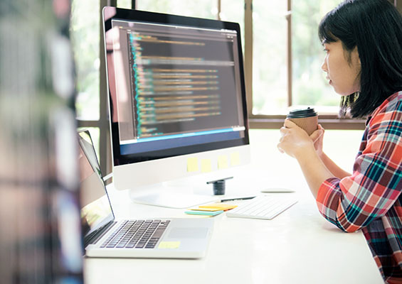 A woman examines Linux code