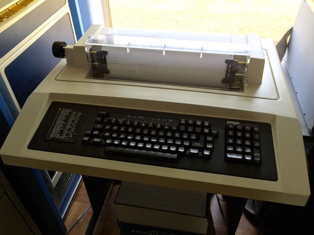 A photo of an old UNIX terminal that looks like a printer with a keyboard