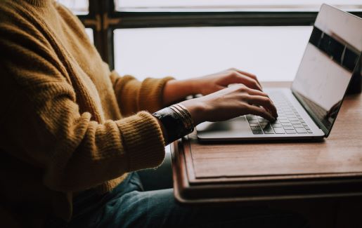 Young woman studying at home using elearning and online training