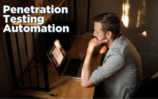 Man sitting at desk working on laptop.