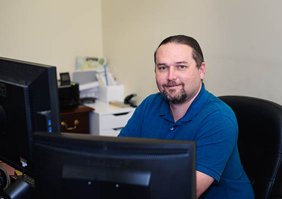 Ray DeJean at his computer