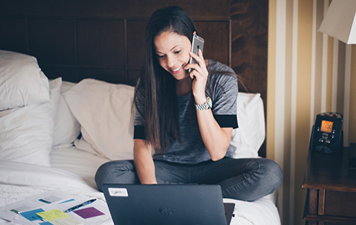 A remote worker on the phone with tech support