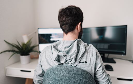 Man working at home during covid-19 at a desk.