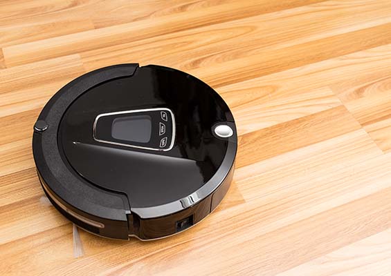 A Roomba on a hardwood floor