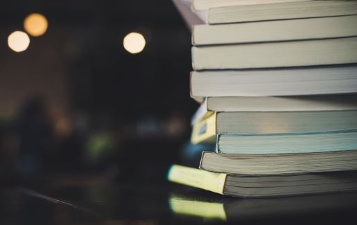 A stack of books to represent that stacking and having multiple IT certifications is beneficial to your IT career.