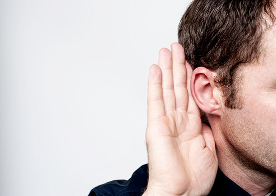 The Secret to Security Skills A man holds his hand up to his ear to hear a secret