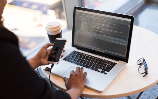 IT Pro working on web development on laptop.