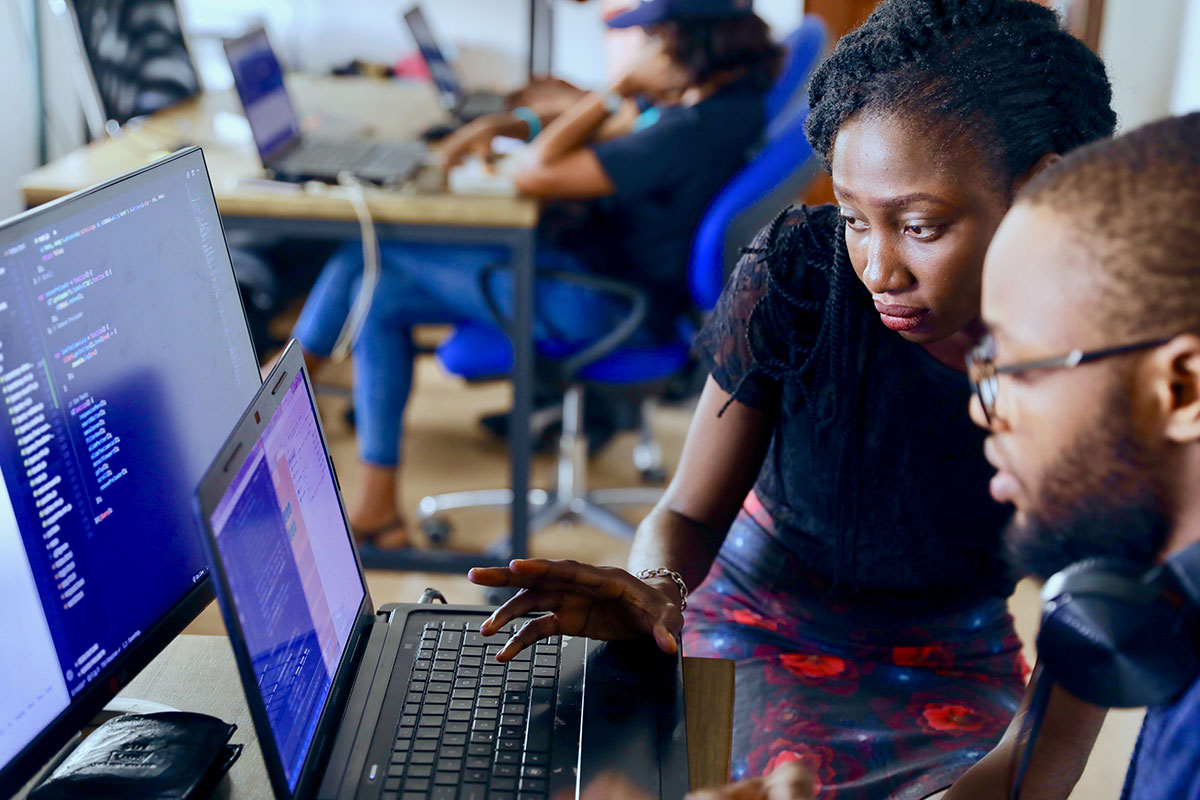 Two people working on a computer