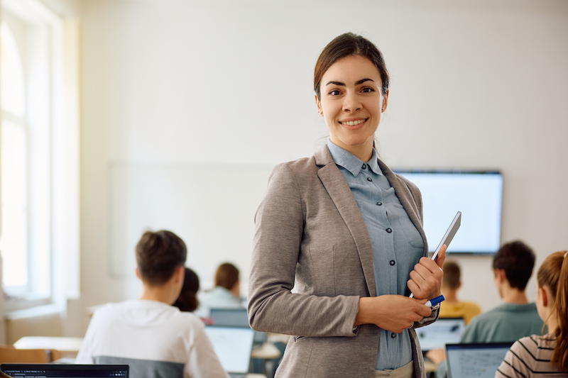 woman on laptop with headphones cropped