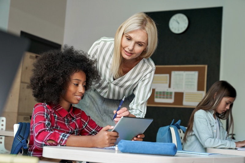 woman teaching students